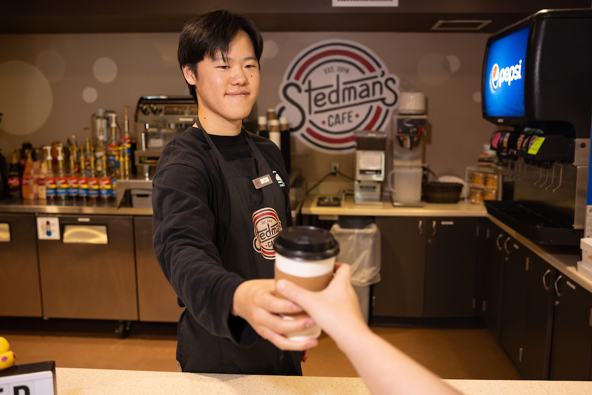 Student Barista, Ray, serving enthusiastic students!