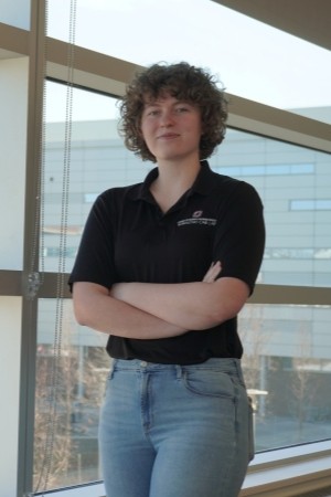 Photo of a Graduate Research Assistant, Avery Nicklous in Mammel Hall