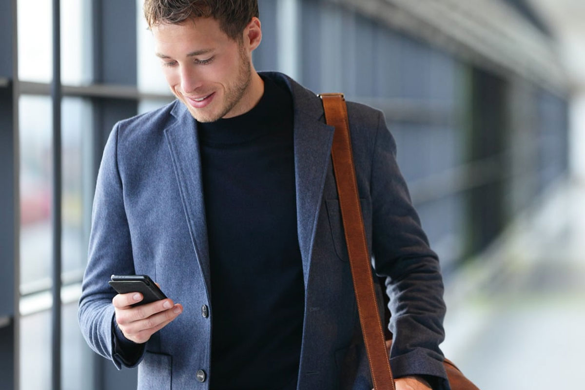 man looking at cell phone