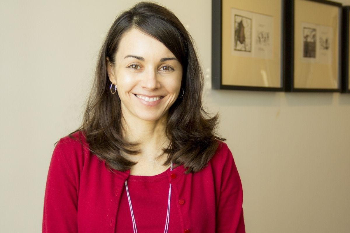 An image of a woman smiling at the camera