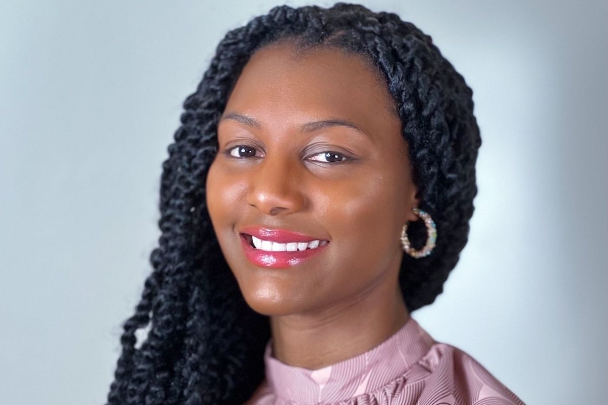 An image of a woman smiling at the camera