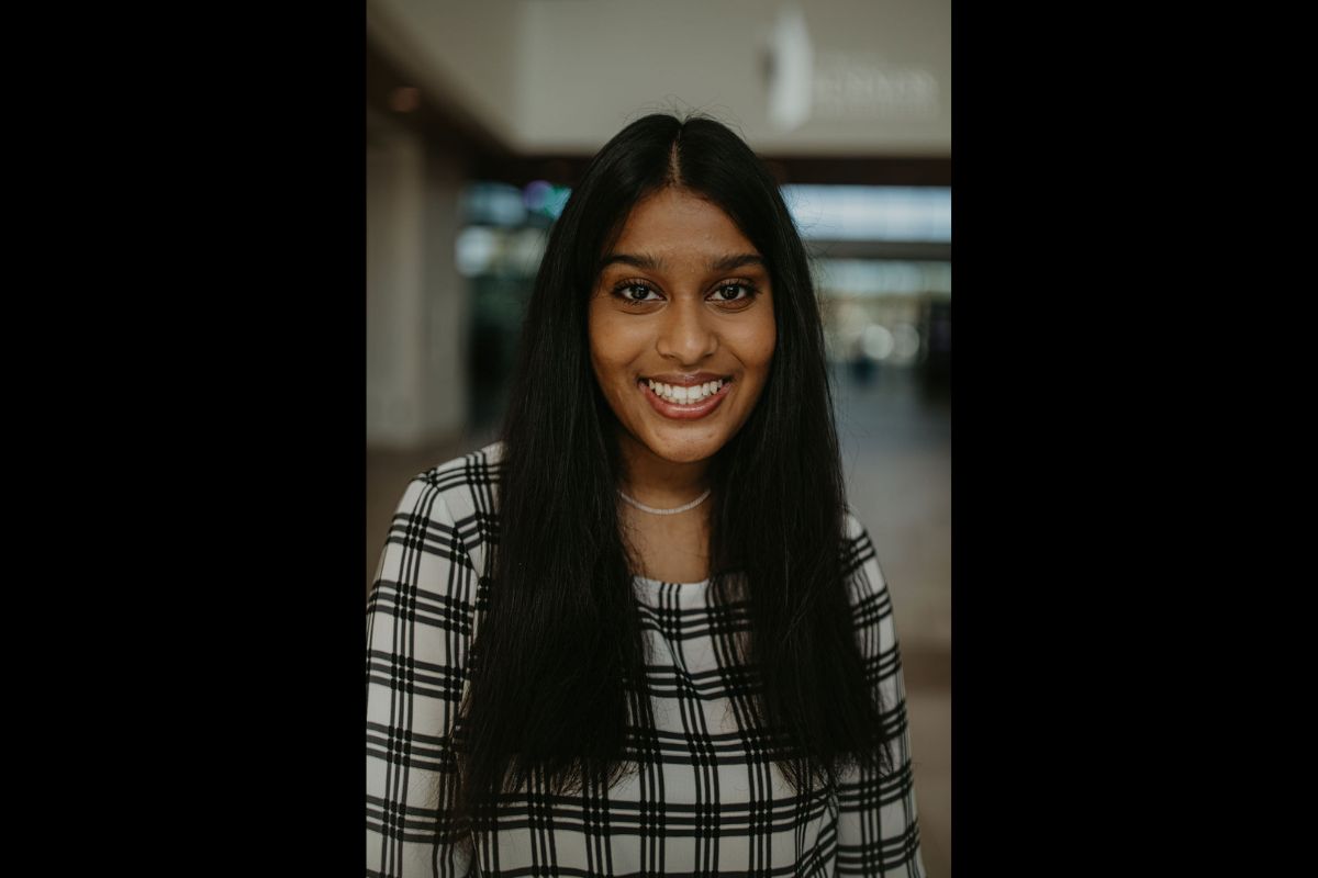 An image of a woman smiling at the camera