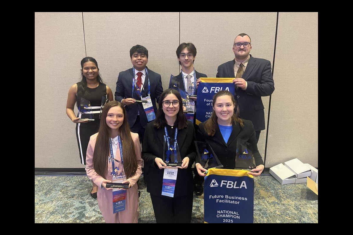 students holding up their FBLA-C prizes for winning at the nationals.