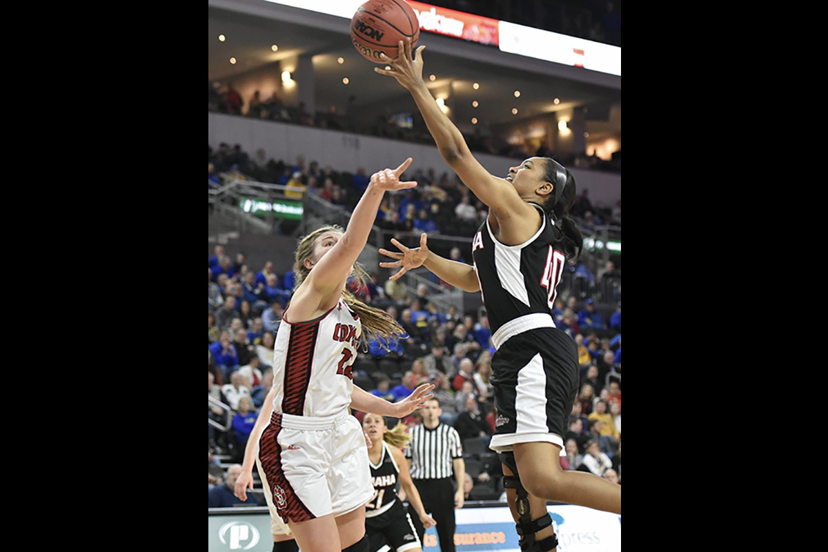 Jay Bridgeman and another woman playing basketball.