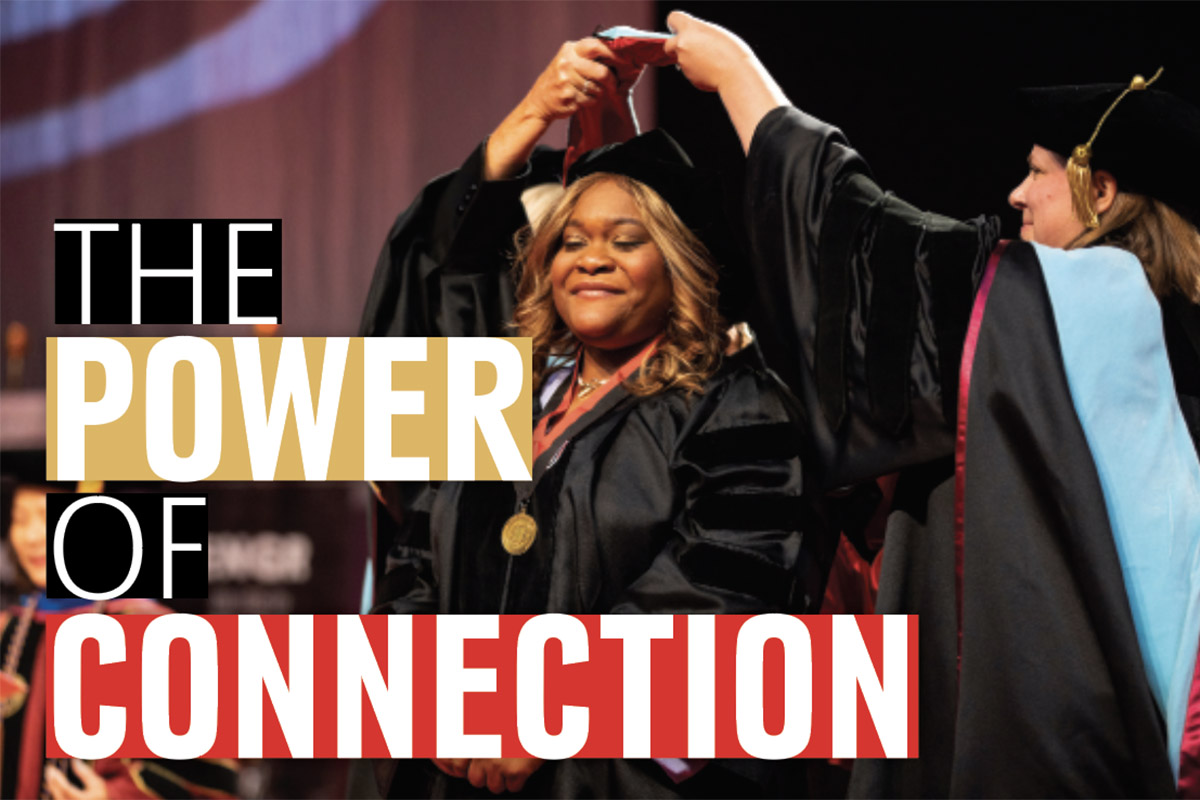 A doctoral student on stage at UNO's Commencement ceremony