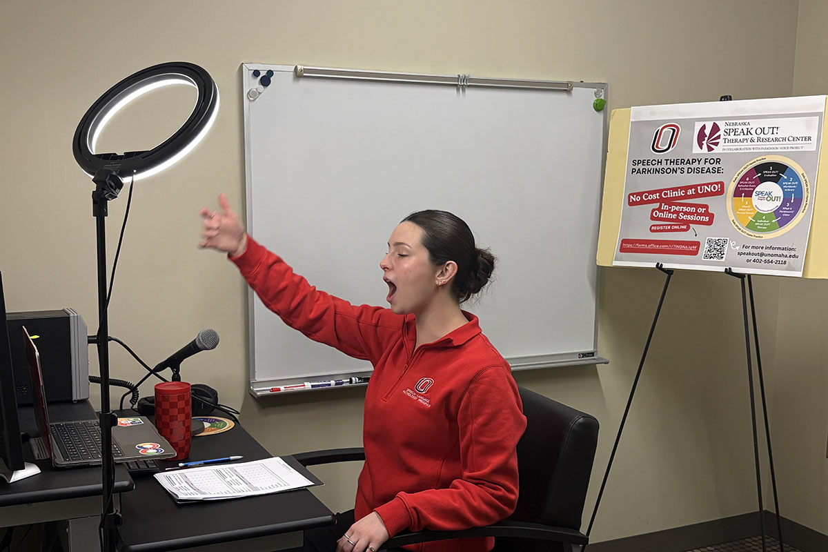 A graduate student works with a client through telehealth