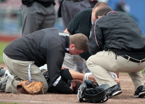 Athletic training students tend to an injury.