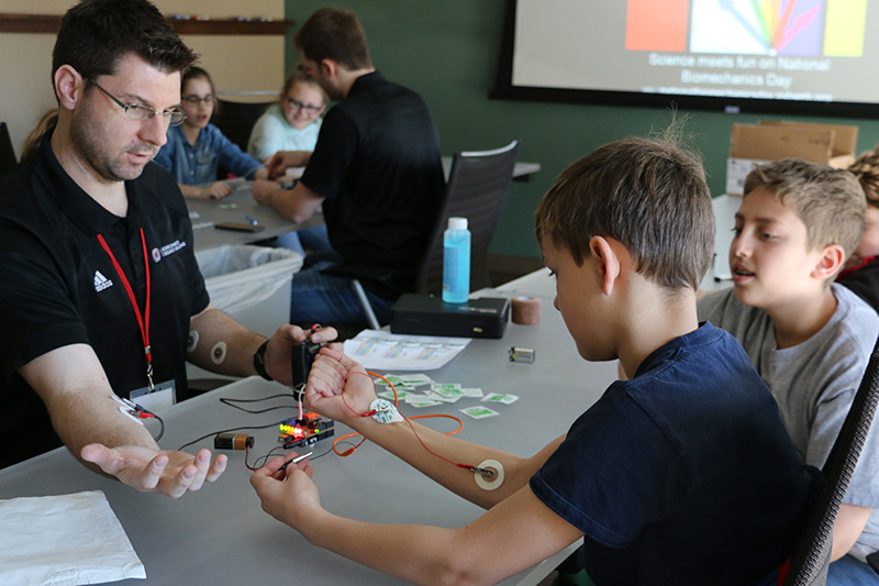 Jeff Kaipust, UNO's Employee of the Year, helps during National Biomechanics Day in April