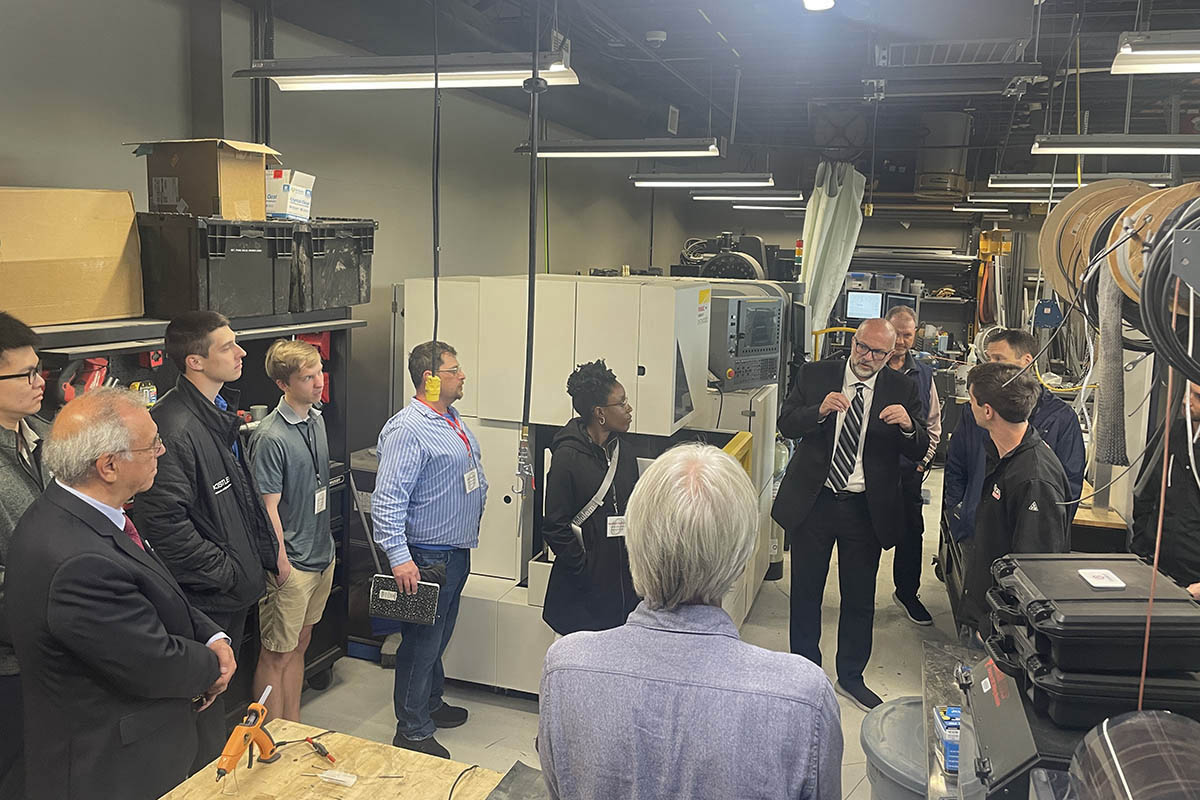 A person conducts a tour of a lab