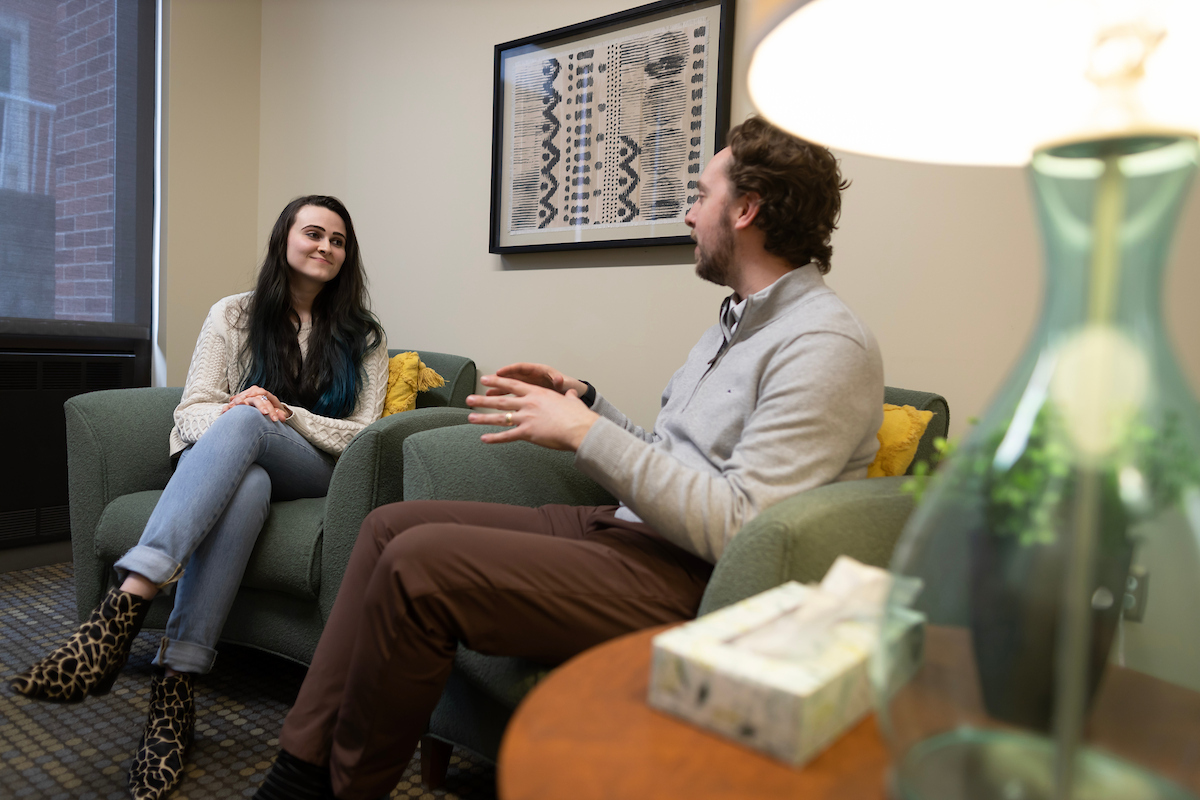 Two counseling student chat in the Community Counseling Clinic at UNO