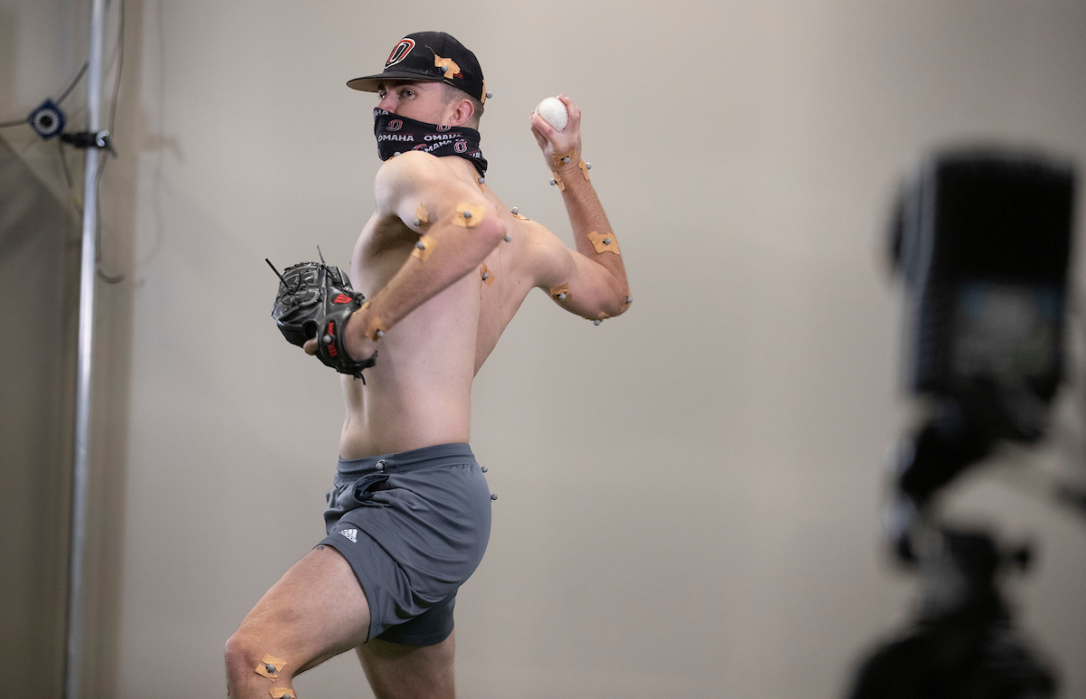 a baseball pitcher is analyzed using motion capture