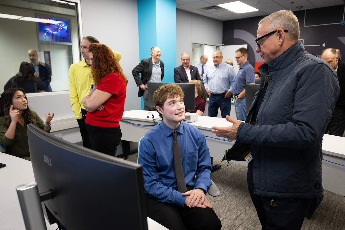 Students from the inaugural Nebraska Cyber Matrix cohort provide guided tours of the lab to event attendees during the Nov. 12 grand opening.