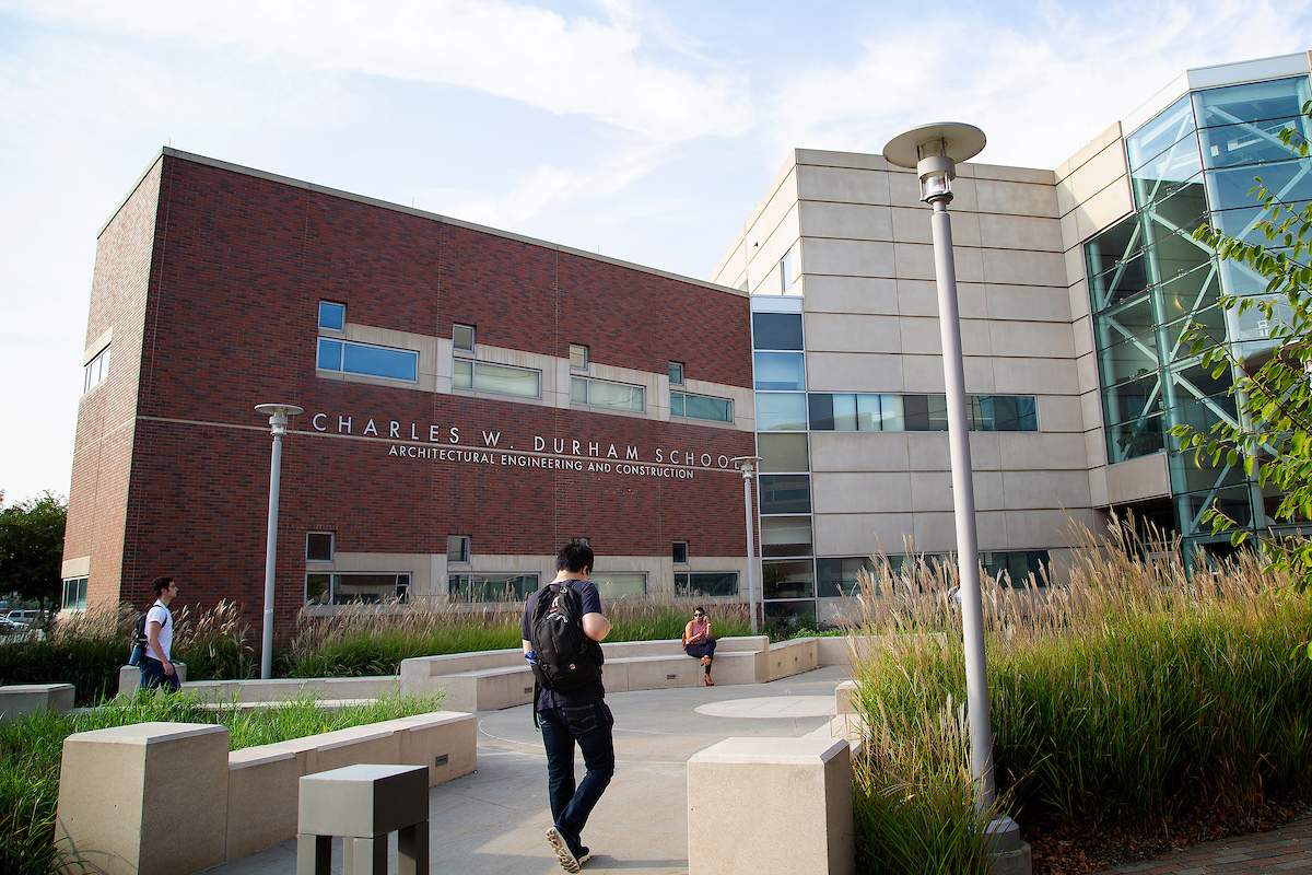 Student walking into a building