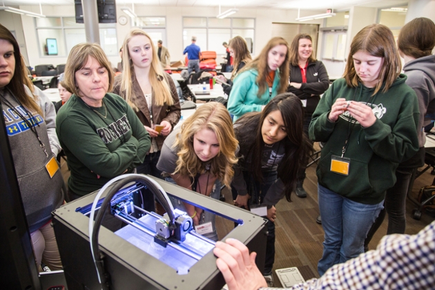 Students check out a 3-D printer during a Microsoft DigiGirlz demonstration at a past CodeCrush event.