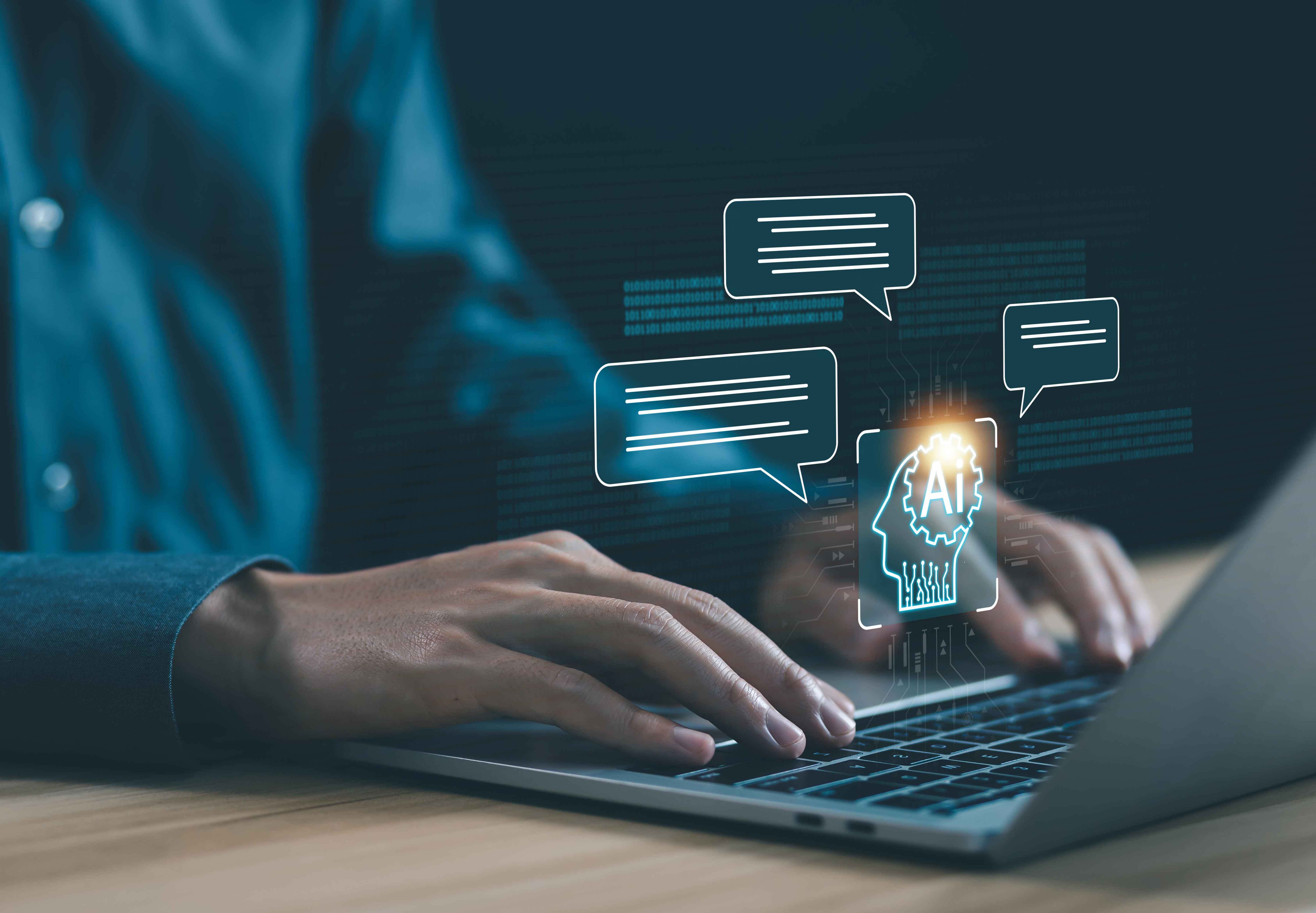 Person typing on a laptop with digital graphics of AI icons and speech bubbles floating above the keyboard, representing artificial intelligence communication.