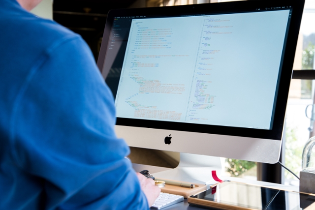 student sitting at a computer