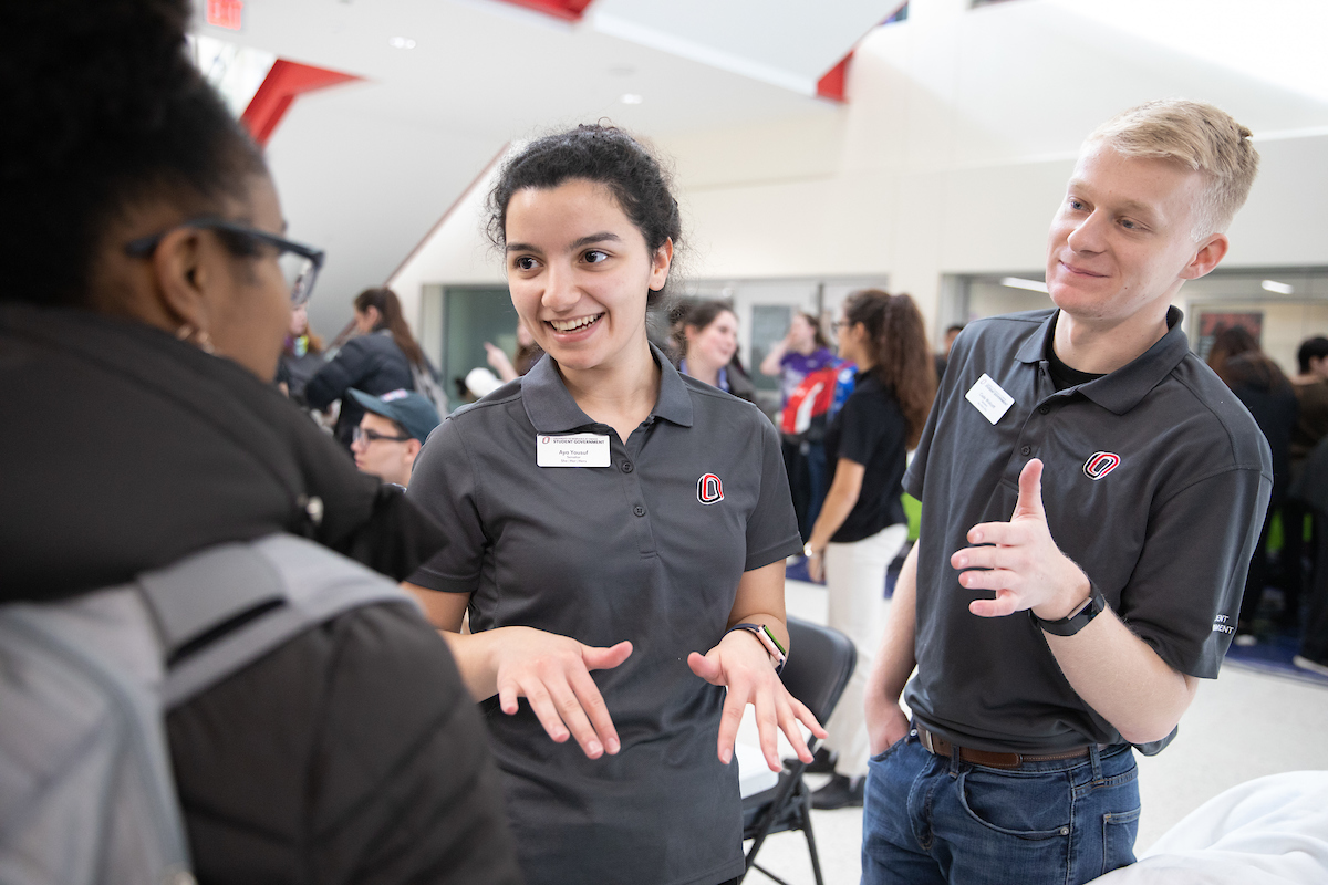 Two students speaking to each other