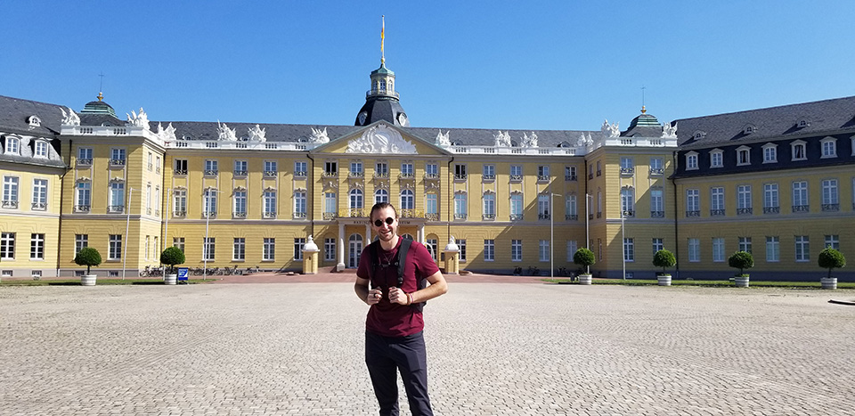 Student standing in front of a historic building in Germany.