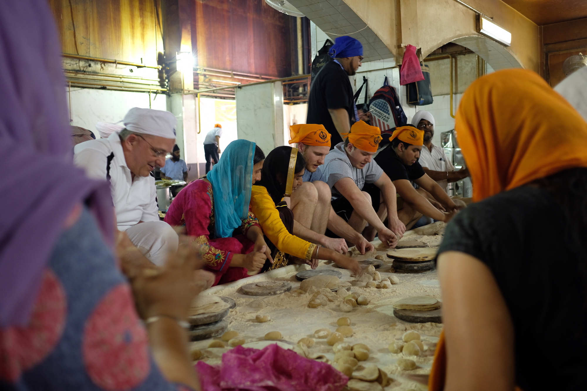 Students roll roti at Gurudwara Bangla Sahib