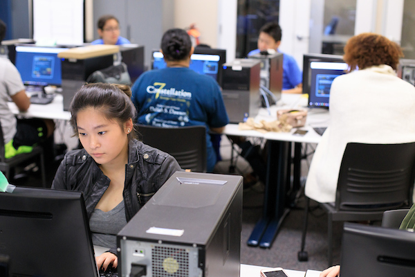 Students looking at computers