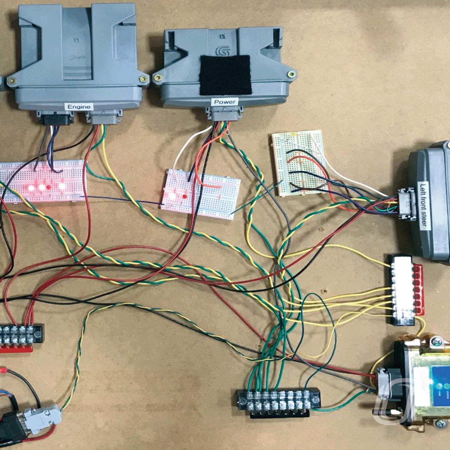 several electronic components spread out on a large table