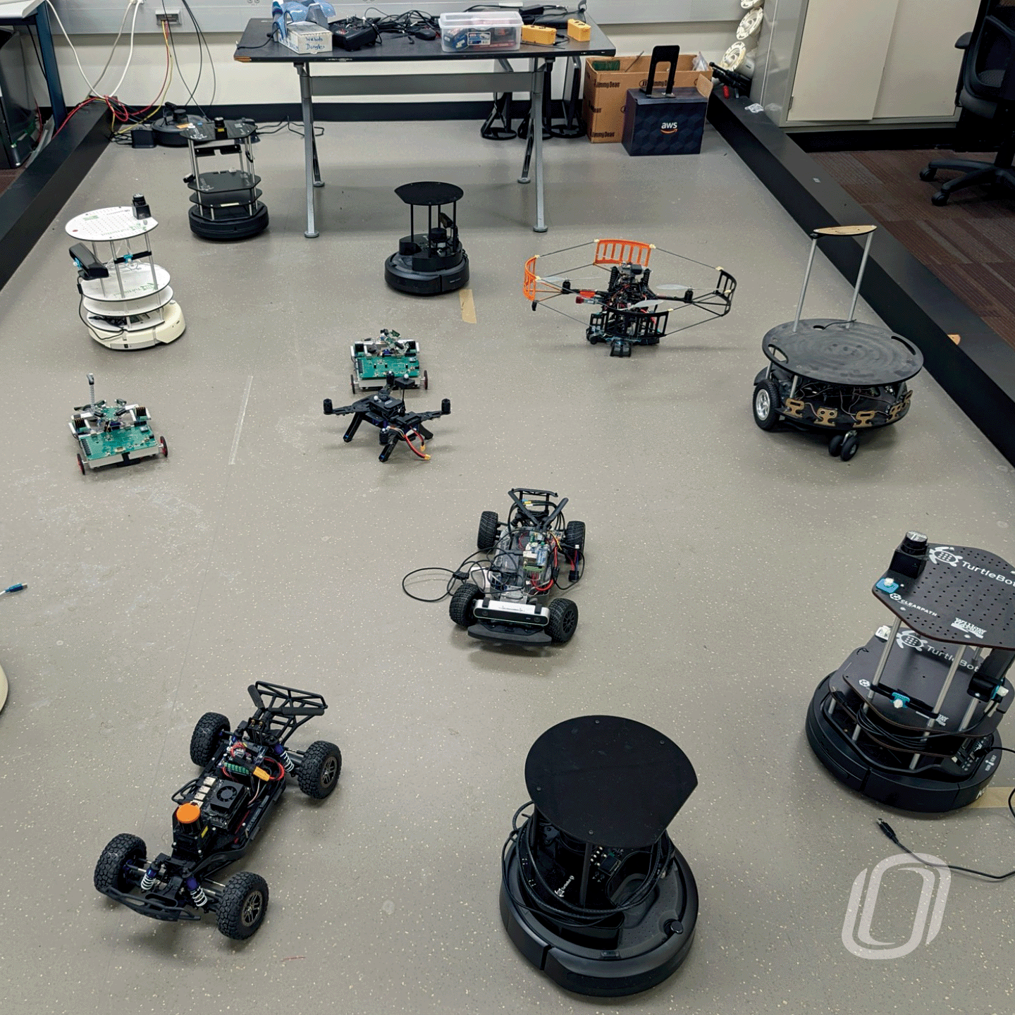 Several misc. robotic vehicles showcased on a large floor