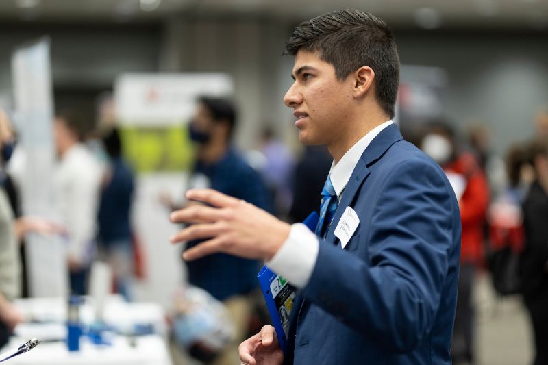 student standing at an event