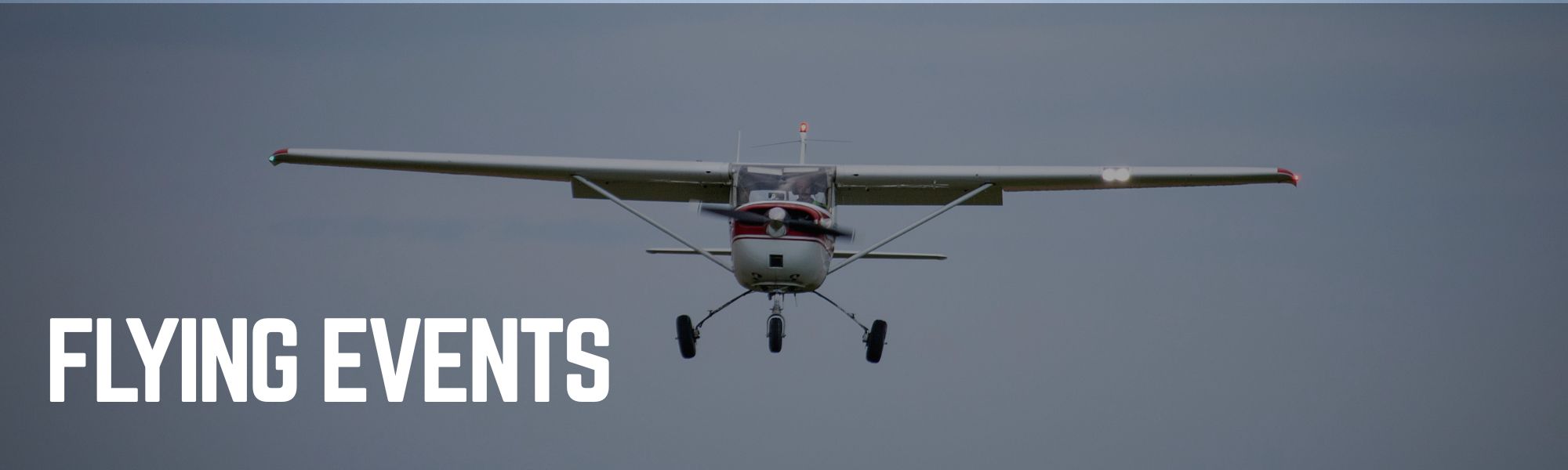 Airplane flying captioned "Flying Events"