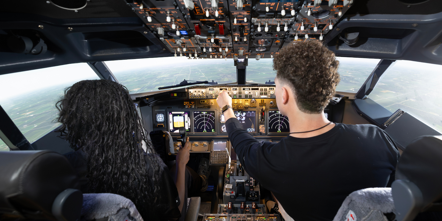 Two students in a 737 simulator