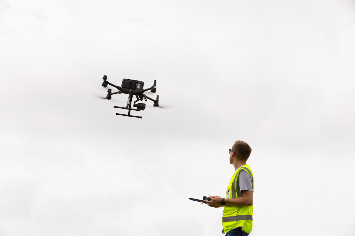 Student flying a drone. 