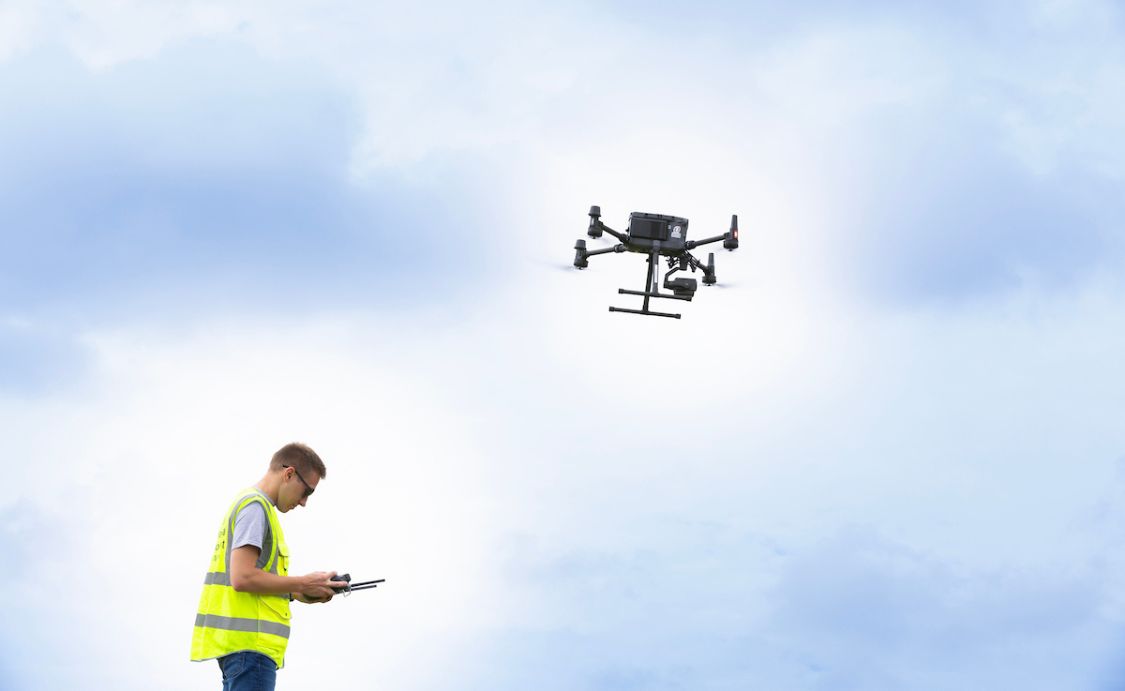 student flying a drone. 