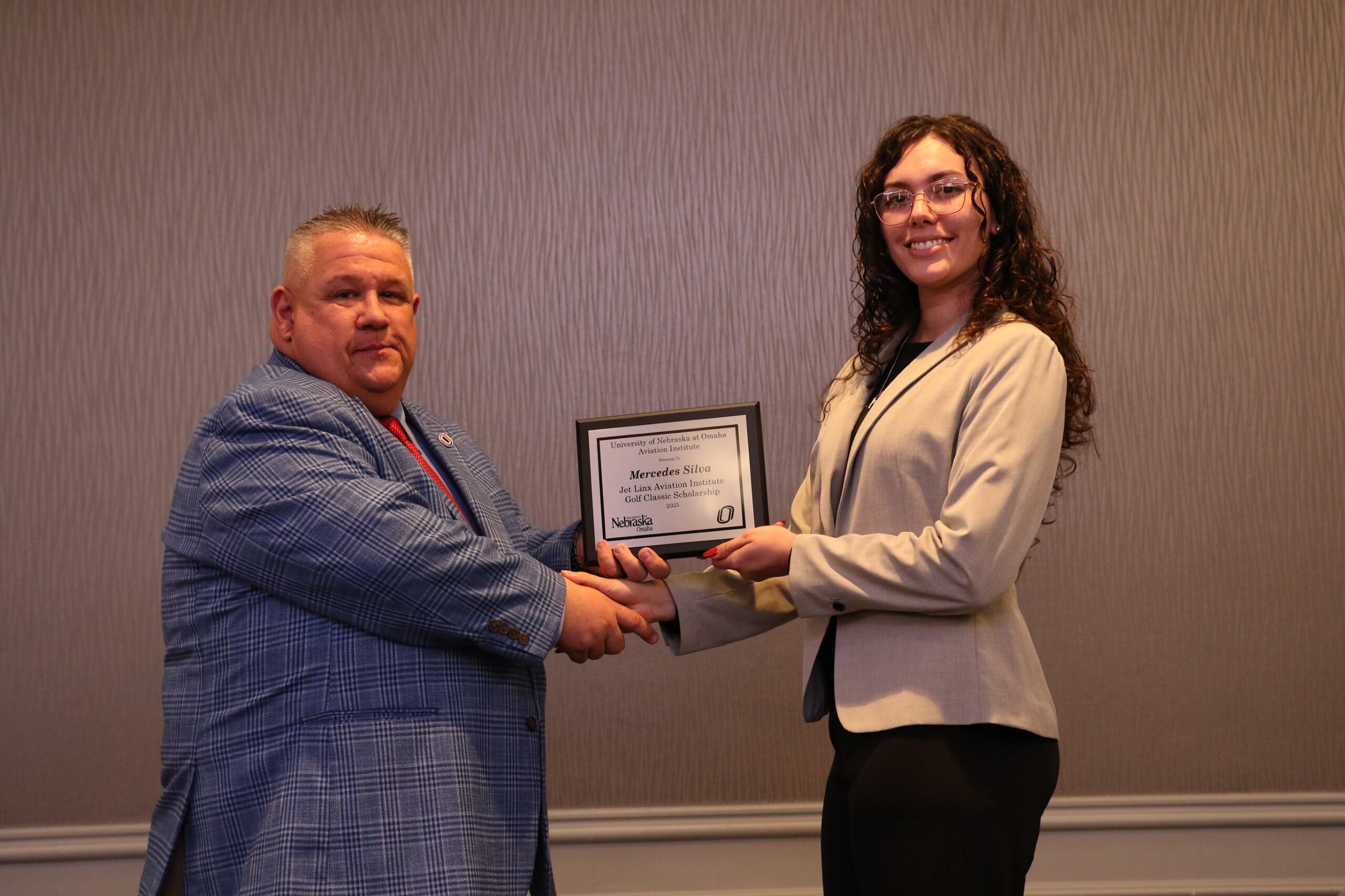 student receiving the Jet Linx Aviation Institute Golf Classic Scholarship