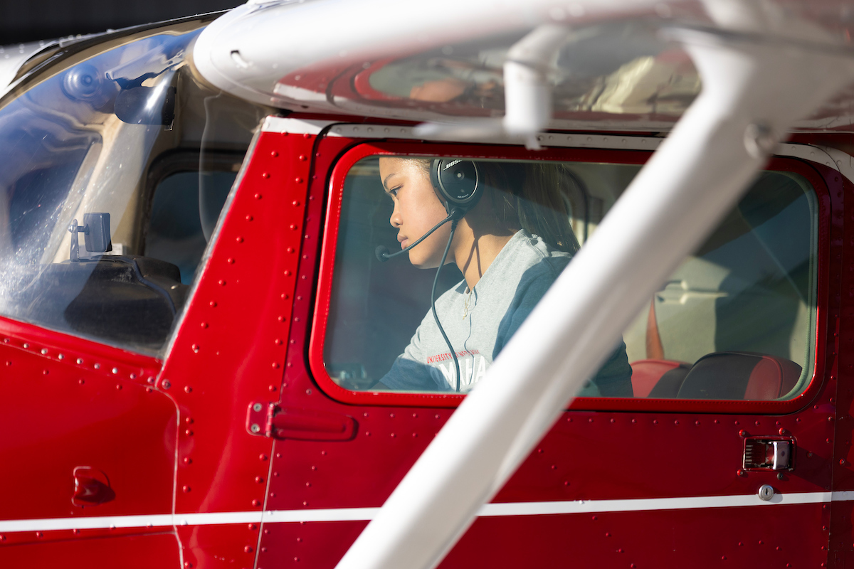 Student in cockpit of an airplane. 