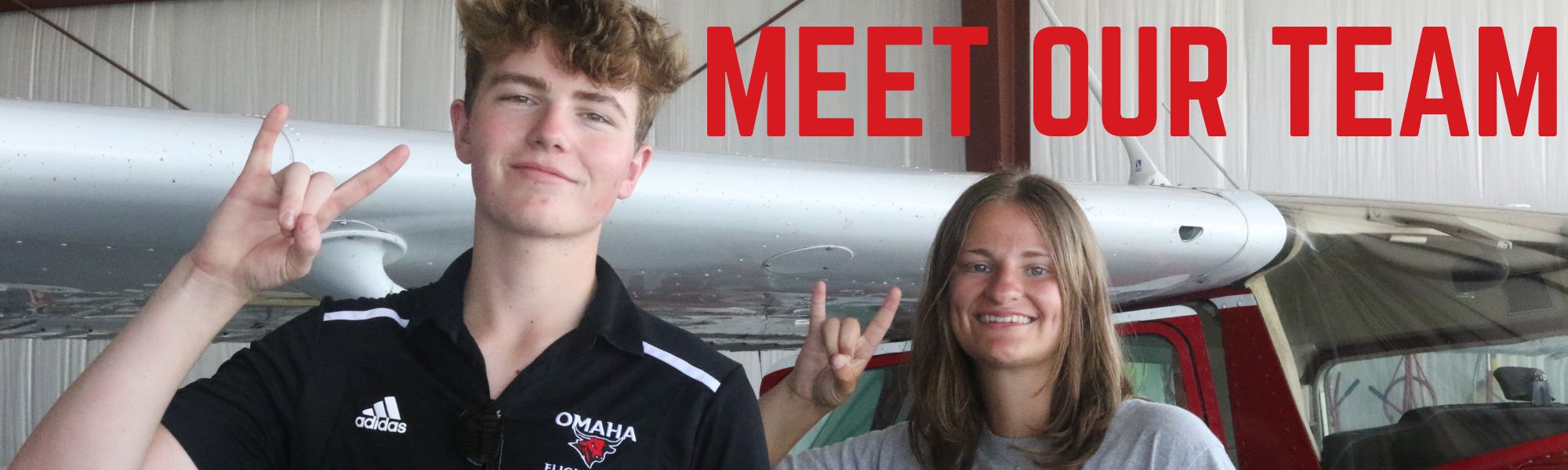 Two Students. Captioned "Meet Our Team".