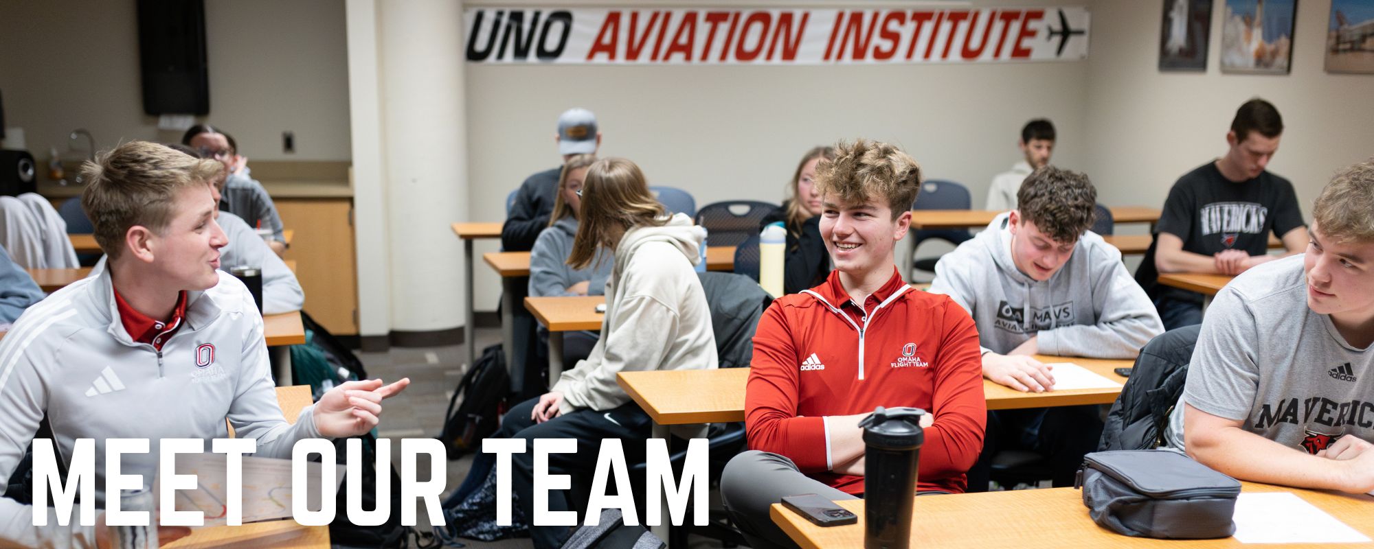 Two Students. Captioned "Meet Our Team".