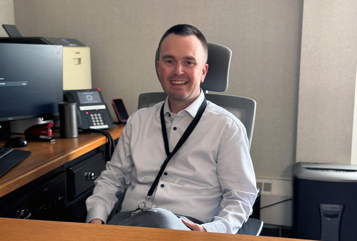 Ryan Stepp at his desk at Eppley Airfield in Omaha.