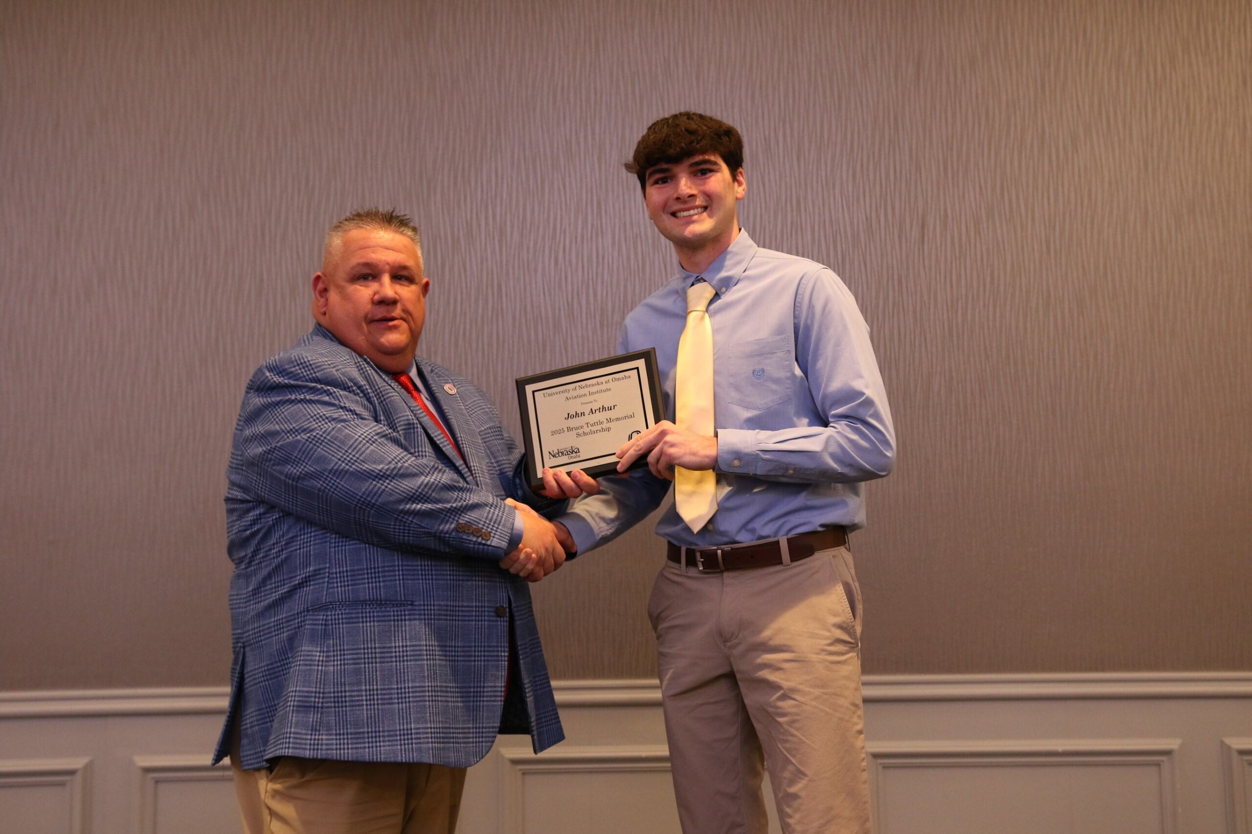 student receiving the Bruce Tuttle Memorial Scholarship