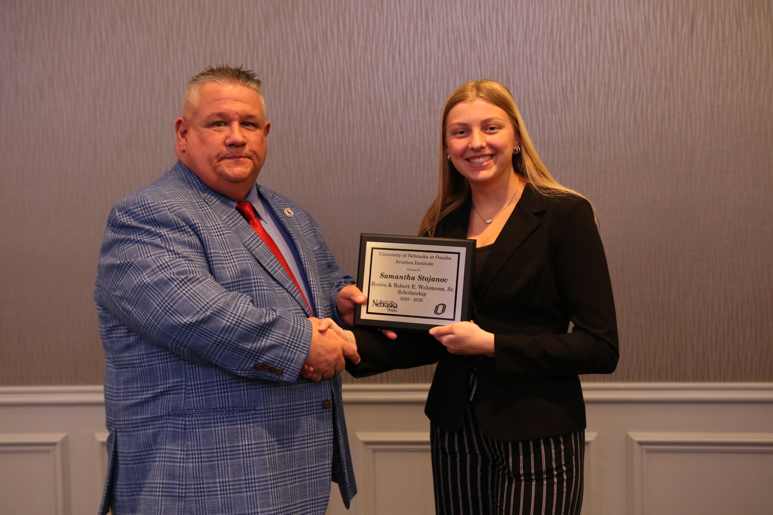student receiving the Robert E. and Rosita C. Wolsmann Memorial Scholarship