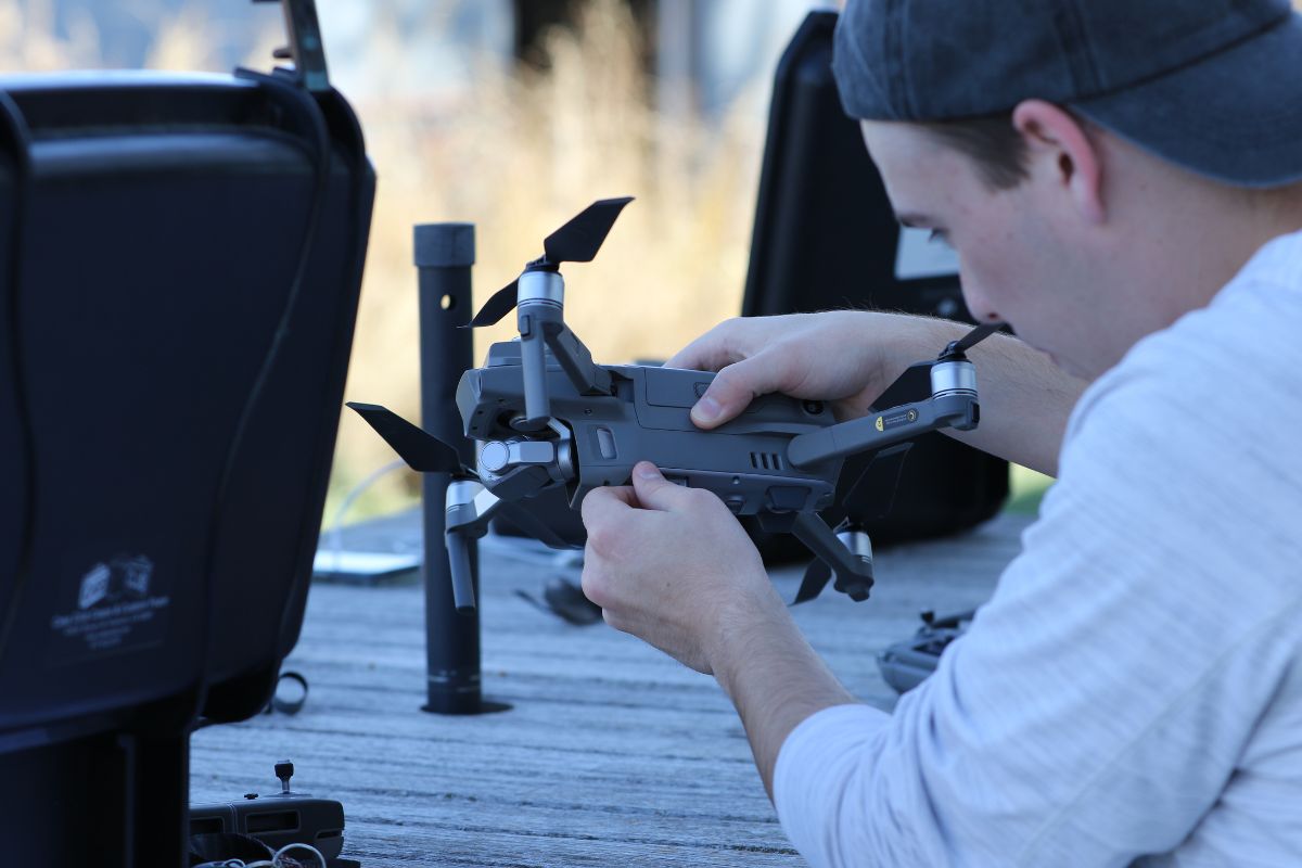 student working on drone