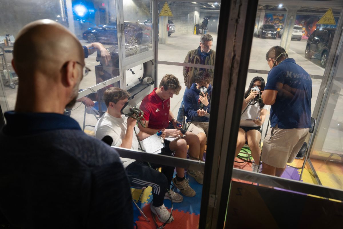 Student in hypoxia chamber