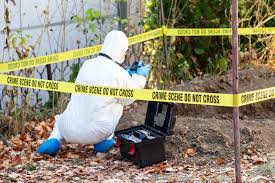 Death Investigator assesses a possible crime scene
