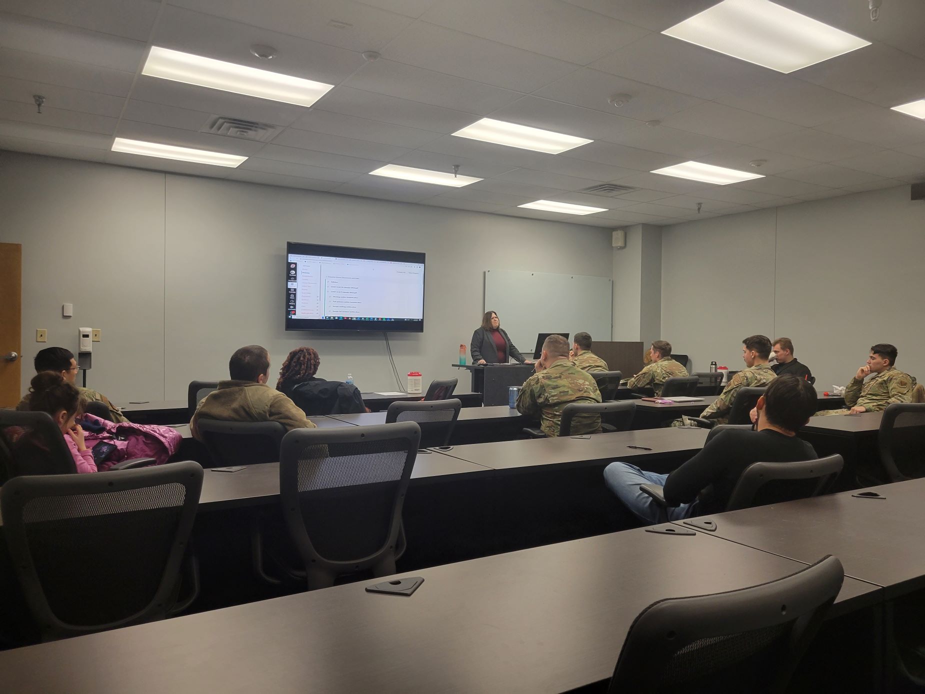 Airman in a class with instructor teaching.