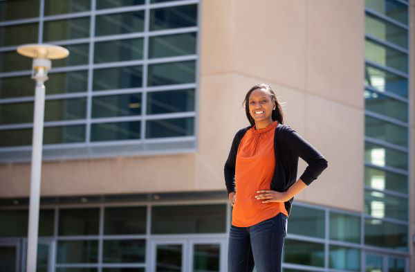 student standing on campus