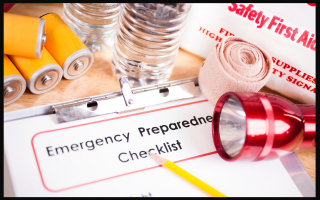 emergency checklist with batteries, gauze, flashlight, and first aid kit.