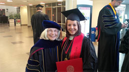 Professor Holley with a student at graduation