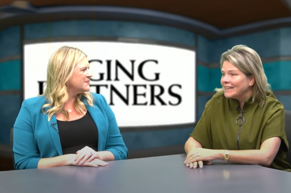 Drs. Lakelyn Hogan Eichenberger and Sarah Teten Kanter in front of a screen that says aging partners