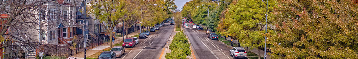 Cars parked on the street in a neighborhood.