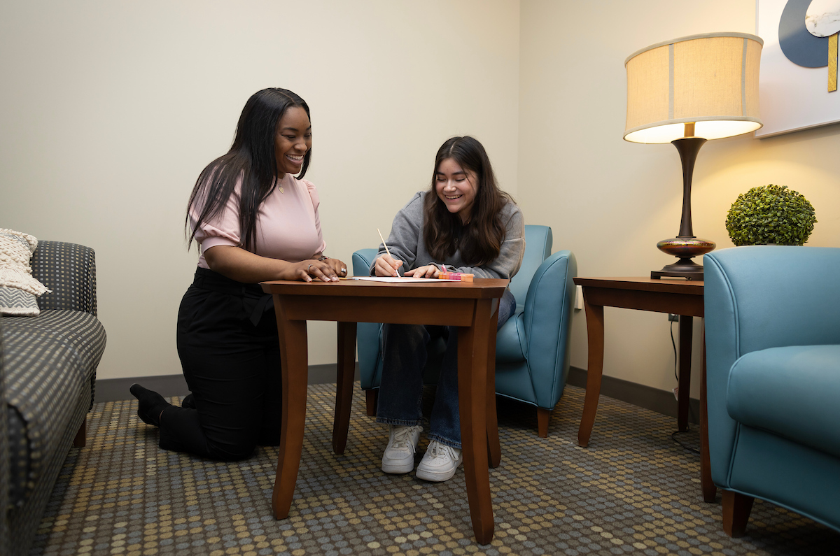 two people talking at a table