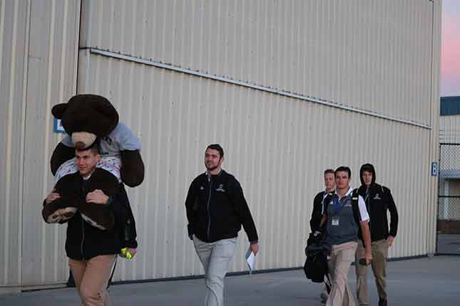 Entering the field with the mascot.