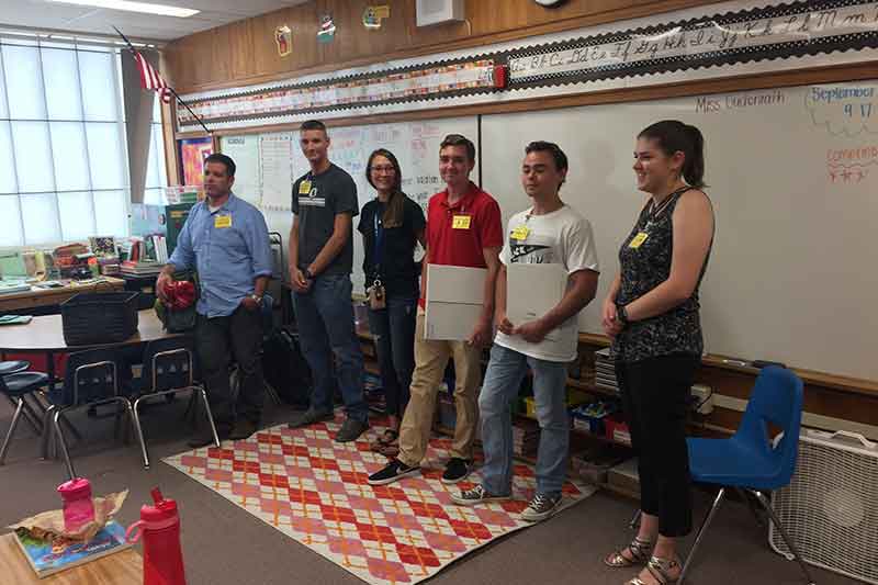 Emergency management students teaching third graders about preparedness.